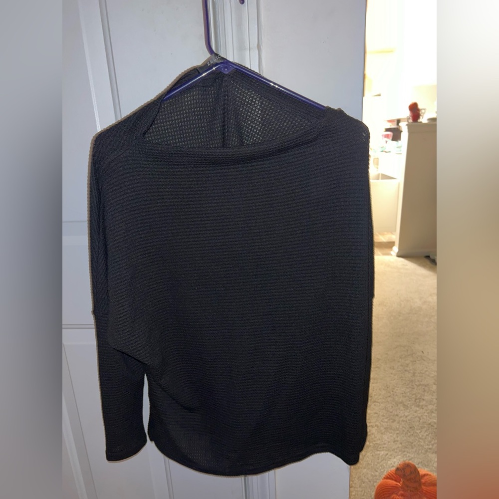 Woman’s black sweater size small